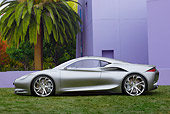 AUT 09 RK1288 01
Infiniti EMERG-E Concept Silver Profile View On Grass By Purple Building