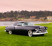 AUT 09 BK0009 01
1953 Pontiac Parisienne Black Concept 3/4 Front View On Grass By Ocean