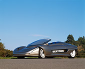 AUT 09 RK0032 02
1992 Bertone Blitz Electric Car 3/4 Side View On Pavement By Trees And Blue Sky
