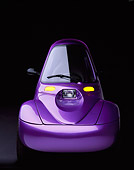 AUT 09 RK0213 02
1998 Corbin Sparrow Electric Car Purple Head On View Parking Lights On Studio Background