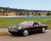 AUT 09 RK0278 07
Ford Thunderbird Convertible Black Concept Car 3/4 Side View On Pavement By Grass Blue Sky