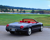 AUT 09 RK0282 01
Ford Thunderbird Convertible Black Concept Car 3/4 Rear View On Pavement By Grass