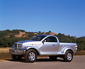 AUT 09 RK0316 01
Dodge Power Wagon Silver Concept Truck 3/4 Side View On Pavement By Hills Blue Sky