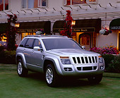AUT 09 RK0339 03
Jeep Commander Silver Concept Car Front 3/4 View On Grass By Building At Dusk