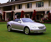 AUT 09 RK0389 06
Lexus SC430 Convertible Concept Silver 3/4 Side View On Grass By Building