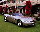 AUT 09 RK0395 03
Chrysler 300 Hemi C Prototype Champagne 3/4 Front View On Grass By Building