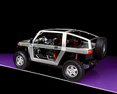 AUT 09 RK0399 16
Model E Ironman Concept Car  3/4 Rear View On Purple Floor Studio