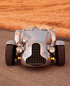 AUT 09 RK0406 01
Special Six Roadster Silver Head On Shot On Pavement By Dry Grass Hill