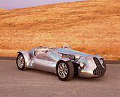 AUT 09 RK0407 04
Special Six Roadster Silver Side 3/4 View On Pavement By Dry Grass Hill