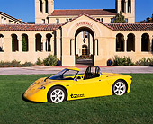 AUT 09 RK0446 05
AC Propulsion tZero Electric Sports Car Prototype Yellow Side 3/4 View On Grass By Building