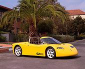 AUT 09 RK0452 05
AC Propulsion tZero Electric Sports Car Prototype Yellow Side 3/4 View On Pavement By Palm Tree