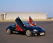 AUT 09 RK0456 02
Spyker C8 Laviolette Coupe Black 3/4 Front View Doors Open On Pavement By Hangar