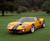 AUT 09 RK0488 03
Ford GT40 Prototype Orange And Black Stripes 3/4 Front View On Grass With Trees