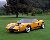 AUT 09 RK0489 01
Ford GT40 Prototype Orange With Black Stripes 3/4 Front View On Grass With Trees