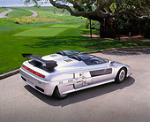 AUT 09 RK0593 01
1988 Audi Aztec Italdesign Giugiaro Spider Silver 3/4 Rear View On Pavement By Grass And Trees