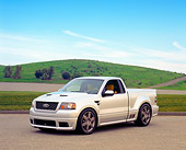 AUT 09 RK0672 02
Ford F-150 Lightning Concept Truck Silver 3/4 Front View On Pavement Grass Hills
