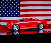 AUT 09 RK0676 13
Ford Mustang GT Convertible Red 3/4 Side View On Mylar Floor America Flag Background