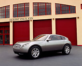 AUT 09 RK0696 03
Infiniti Triant Pewter Concept Car 3/4 Front View By Garage Doors