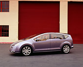 AUT 09 RK0706 03
Nissan Serenity Pewter Concept Car 3/4 Side View On Pavement By Garage Doors