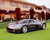 AUT 09 RK0747 02
Chrysler ME Four-Twelve Gray 3/4 Front View On Grass By Building