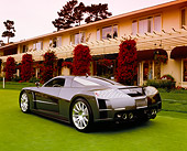 AUT 09 RK0752 01
Chrysler ME Four-Twelve Gray 3/4 Rear View On Grass By Building