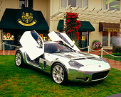 AUT 09 RK0790 01
Ford Shelby GR-1 Aluminium Body 3/4 Front View Doors Up On Grass By Building