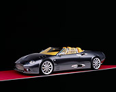 AUT 09 RK0829 07
2005 Spyker C12 La Turbie Spyder Gray 3/4 Side View On Red Floor Studio