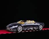 AUT 09 RK0830 07
2005 Spyker C12 La Turbie Spyder Gray 3/4 Side View On Red Floor Checkered Line Studio