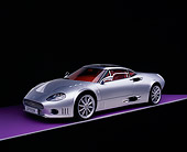 AUT 09 RK0832 14
2006 Spyker C8 Double 12 S Silver 3/4 Front View On Purple Floor Studio