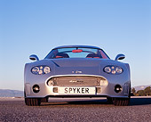 AUT 09 RK0848 01
2006 Spyker C8 Double 12 S Silver Low Head On View On Pavement Blue Sky