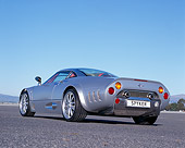 AUT 09 RK0849 01
2006 Spyker C8 Double 12 S Silver Low 3/4 Rear View On Pavement Blue Sky