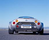 AUT 09 RK0851 01
2006 Spyker C8 Double 12 S Silver Low Rear View On Pavement Blue Sky