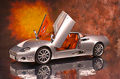 AUT 09 RK0863 01
2005 Spyker C8 Double 12S Silver 3/4 Front View On Mylar Floor Doors Open