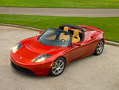 AUT 09 RK0888 01
Tesla Roadster Electric Car Red Overhead 3/4 Front View On Pavement By Grass And Trees