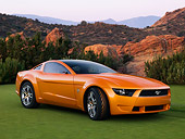 AUT 09 RK1031 01
Italdesign Mustang Concept By Giugiaro Orange 3/4 Front View On Grass By Mountains