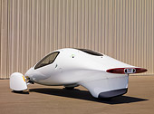 AUT 09 RK1071 01
2008 Aptera Typ-1 Prototype Hybrid Vehicle White 3/4 Rear View On Pavement