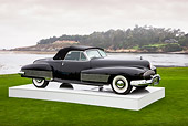 AUT 09 RK1072 01
1938 Buick Y-Job Concept Convertible Black 3/4 Front View On Platform On Grass By Ocean