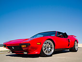 AUT 10 RK0021 01
1974 De Tomaso Pantera Red  Low 3/4 Side View On Pavement