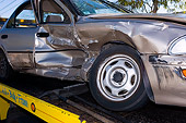 AUT 11 RK0003 01
Detail Of Wrecked Geo Prizm On Flatbed Tow Truck