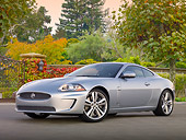 AUT 12 BK0004 01
2011 Jaguar XKR Coupe Silver 3/4 Front View On Pavement By Gate And Autumn Trees