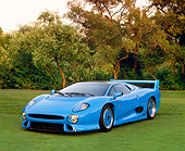 AUT 12 RK0145 04
1994 Jaguar XJ220 Blue 3/4 Front View On Grass Trees Background