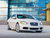 AUT 12 RK0325 01
2010 Jaguar XFR White 3/4 View On Pavement By Building