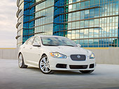 AUT 12 RK0326 01
2010 Jaguar XFR White 3/4 View On Pavement By Building
