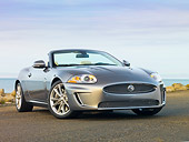 AUT 12 RK0340 01
2010 Jaguar XKR Convertible Silver 3/4 Front View On Pavement By Water