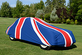 AUT 12 RK0373 01
Classic Jaguar With British Flag Car Cover 3/4 View On Grass By Trees