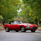 AUT 12 RK0014 08
1964 Jaguar XKE Convertible Red 3/4 Low Front View On Pavement By Trees