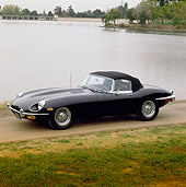 AUT 12 RK0023 01
1969 Black Jaguar XKE 3/4 Side View By Lake And Trees At Dusk