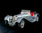 AUT 12 RK0047 02
1938 Jaguar SS-100 Convertible Silver 3/4 Front View Studio Background