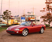 AUT 12 RK0089 01
2001 Jaguar XK8 CNV Convertible Red 3/4 Front View On Dirt By Harbor