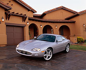AUT 12 RK0114 01
2001 Jaguar XKR Silverstone Coupe 3/4 Front View On Driveway By House